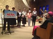 Bishop O'Connell and others bless NETWORK Nuns on the Bus