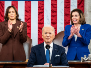 President Biden in front of a microphone