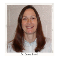 Dr. Laura Lewis headshot - white woman with brown hair in a white button down shirt