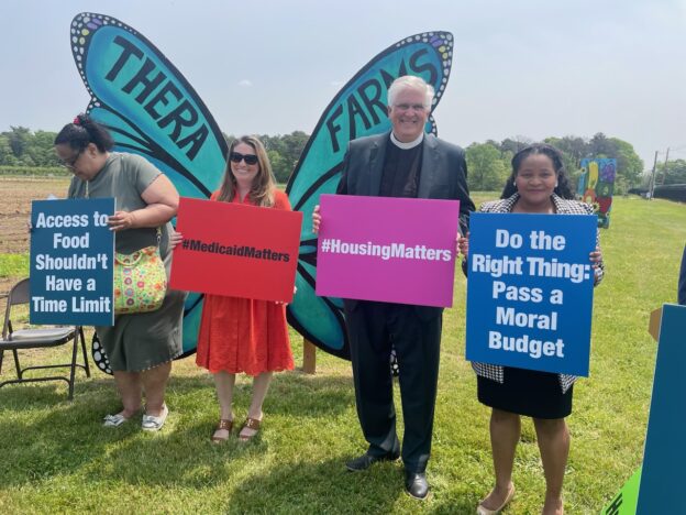 Justice-seekers defend vital human needs programs from federal budget cuts at NETWORK's Care Not Cuts rally in Brentwood, N.Y., on May 22.