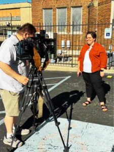 NETWORK organizer Sr. Eilis McColluh, HM, speaks to the media about the Youngstown, OH Care Not Cuts Rally