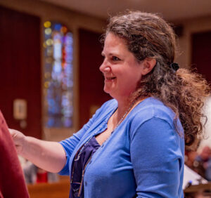 Sarah Christopherson is a tax justice advocate, seen here on the 2024 Nuns on the Bus & Friends tour.
