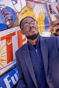 Curtis Da’Von of Clean Water Action gets a selfie with the Bus at the Oct. 5, 2024 Nuns on the Bus & Friends rally in Pittsburgh. Photo: Jacob Schatz, CCR Studios 