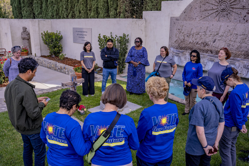 Nuns on the Bus & Friends pray at Cesar Chavez grave.